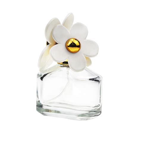 perfume with white flower top.